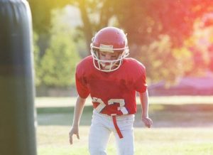 Boy in football uniform